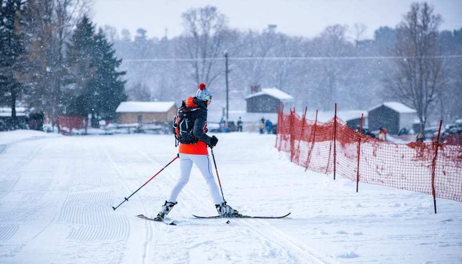 Person cross-country skiing through snowy forest in winter outdoor fitness activity